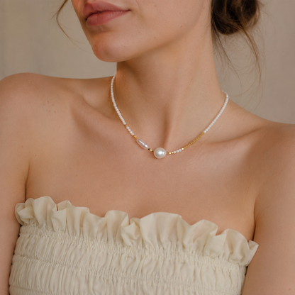 Model wearing a 45cm asymmetric baroque pearl necklace