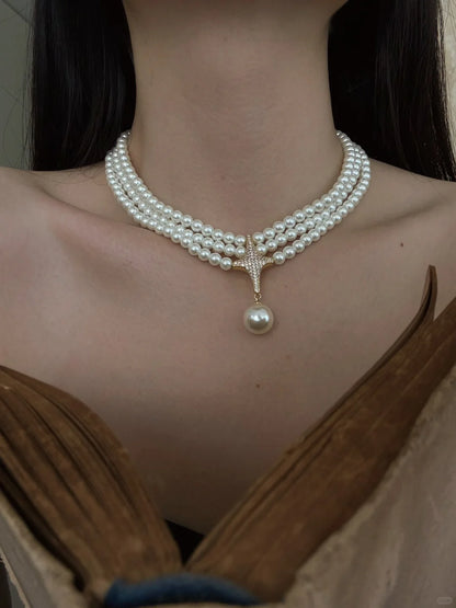 Styled view of multi-strand choker high-lustre freshwater pearl necklace for weddings