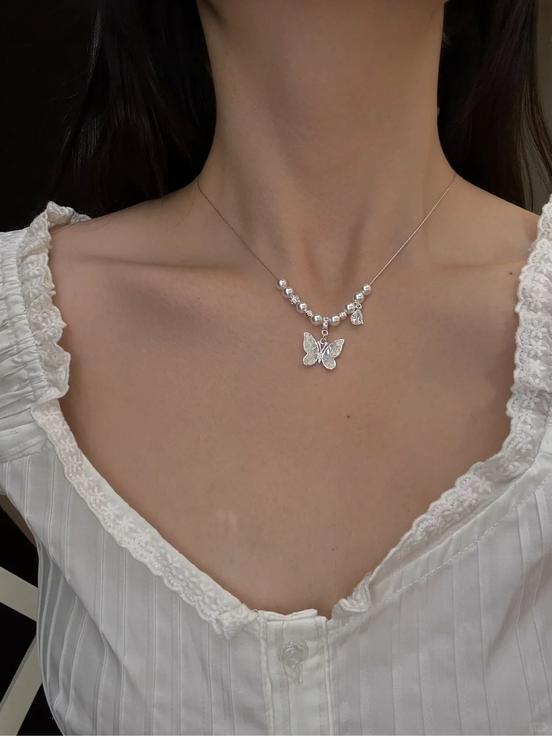 Front view of butterfly pendant high-lustre freshwater pearl necklace for weddings