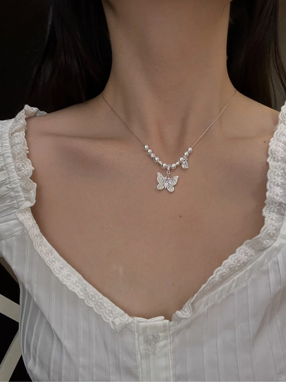 Front view of butterfly pendant high-lustre freshwater pearl necklace for weddings