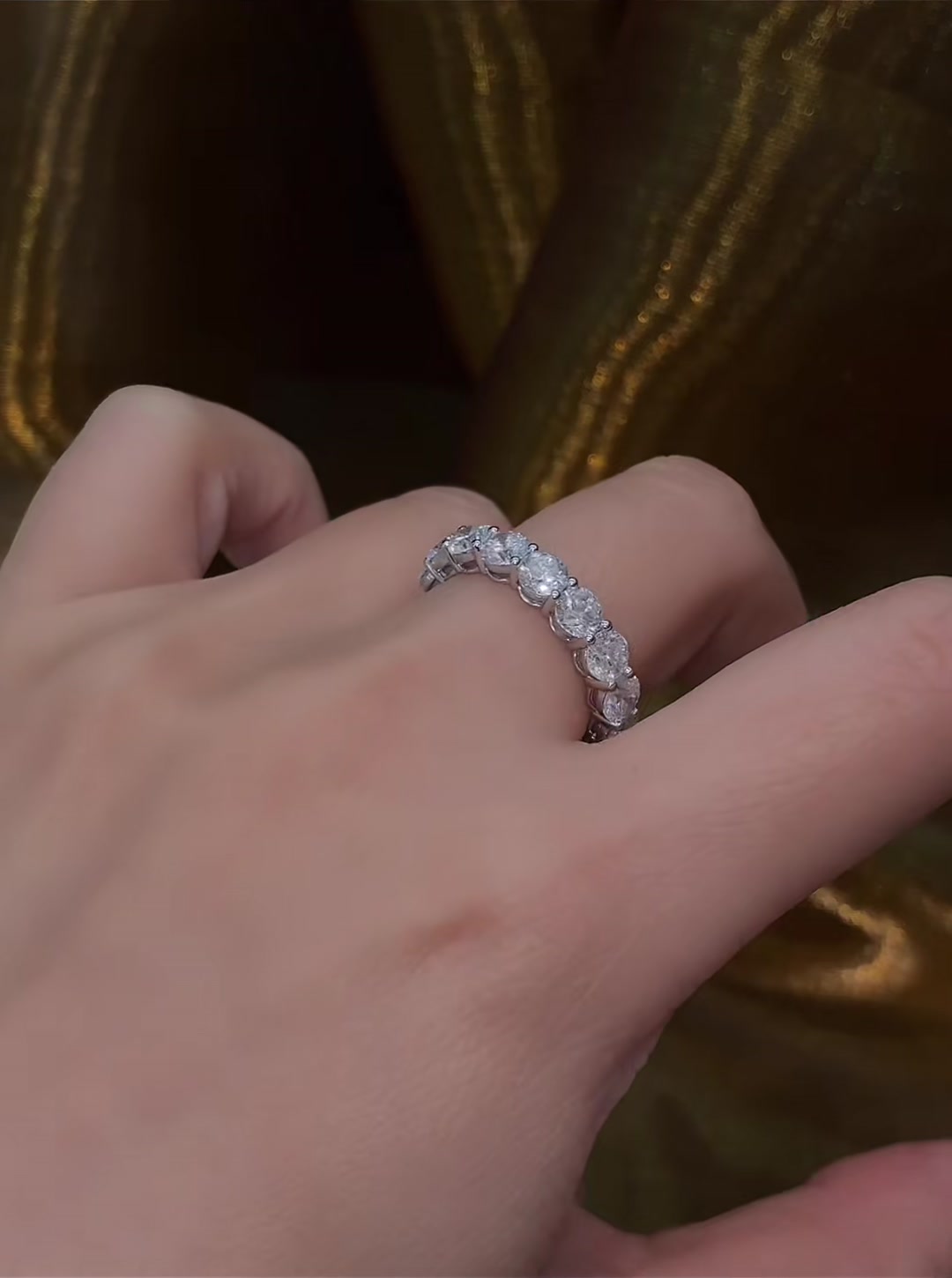 Close-up of lab-grown diamond emerald cut full eternity ring for wedding bands