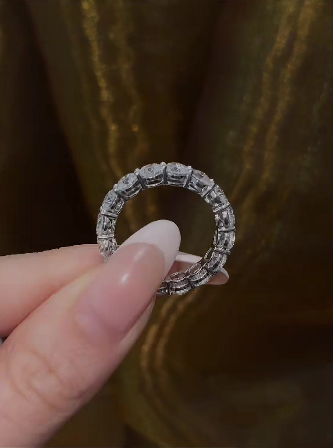 Styled view of lab-grown diamond emerald cut full eternity ring for wedding bands