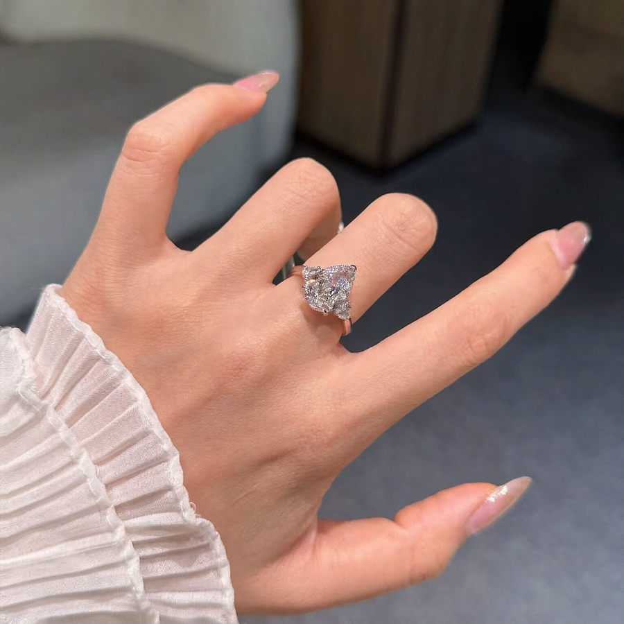 Front view of pear-cut lab-grown diamond halo engagement ring for romantic proposals