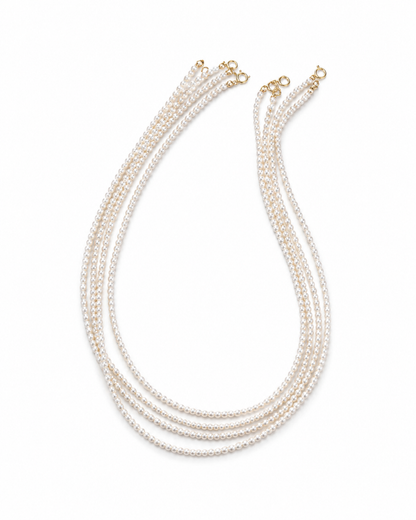 Étoile 4mm triple-strand freshwater pearl necklace on a white background