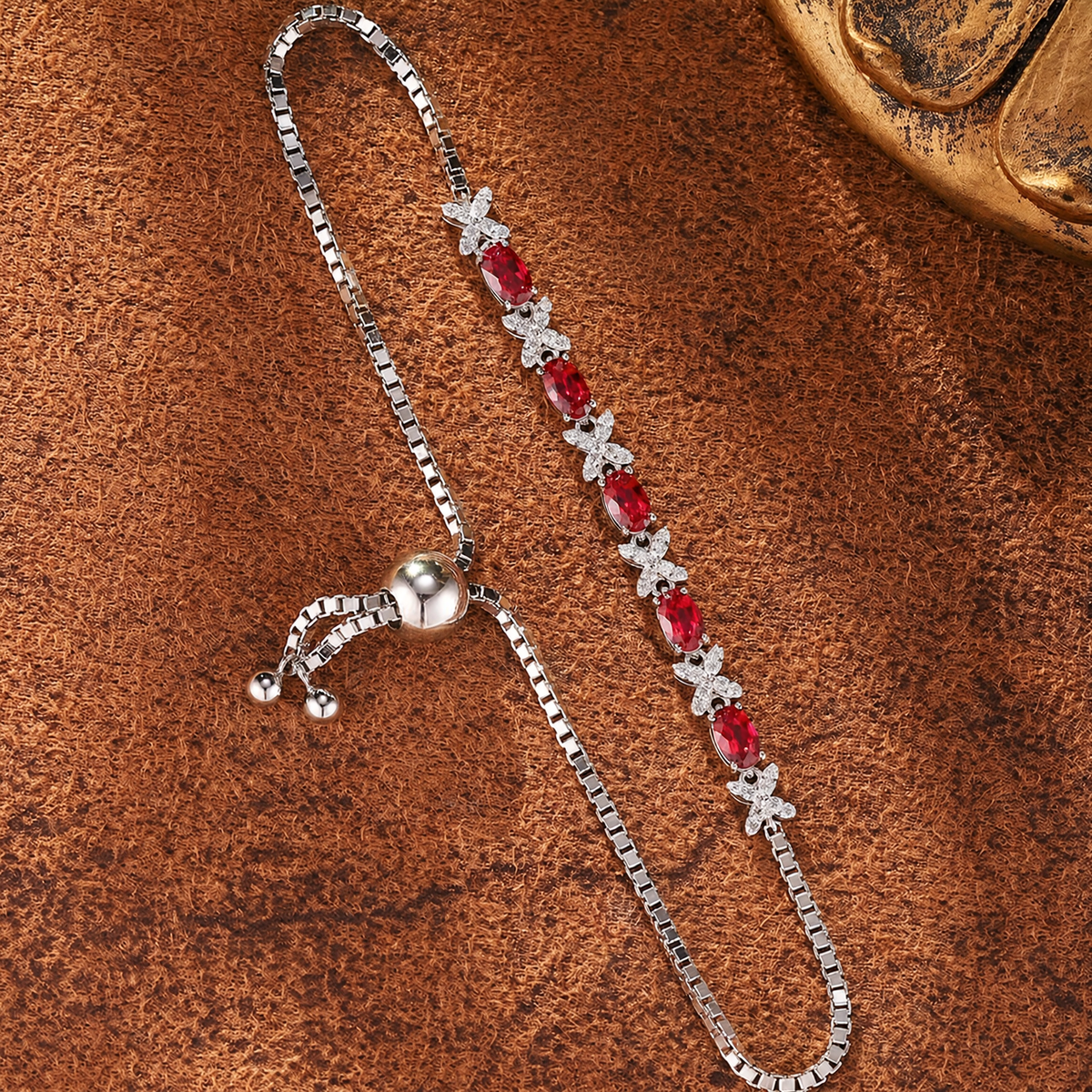 Close-up of lab-grown ruby floral bracelet in 16K gold for anniversary gifts