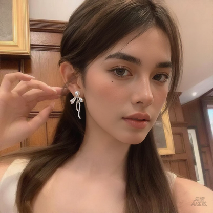 Elegant freshwater pearl bow earrings styled for romantic dinner outfits