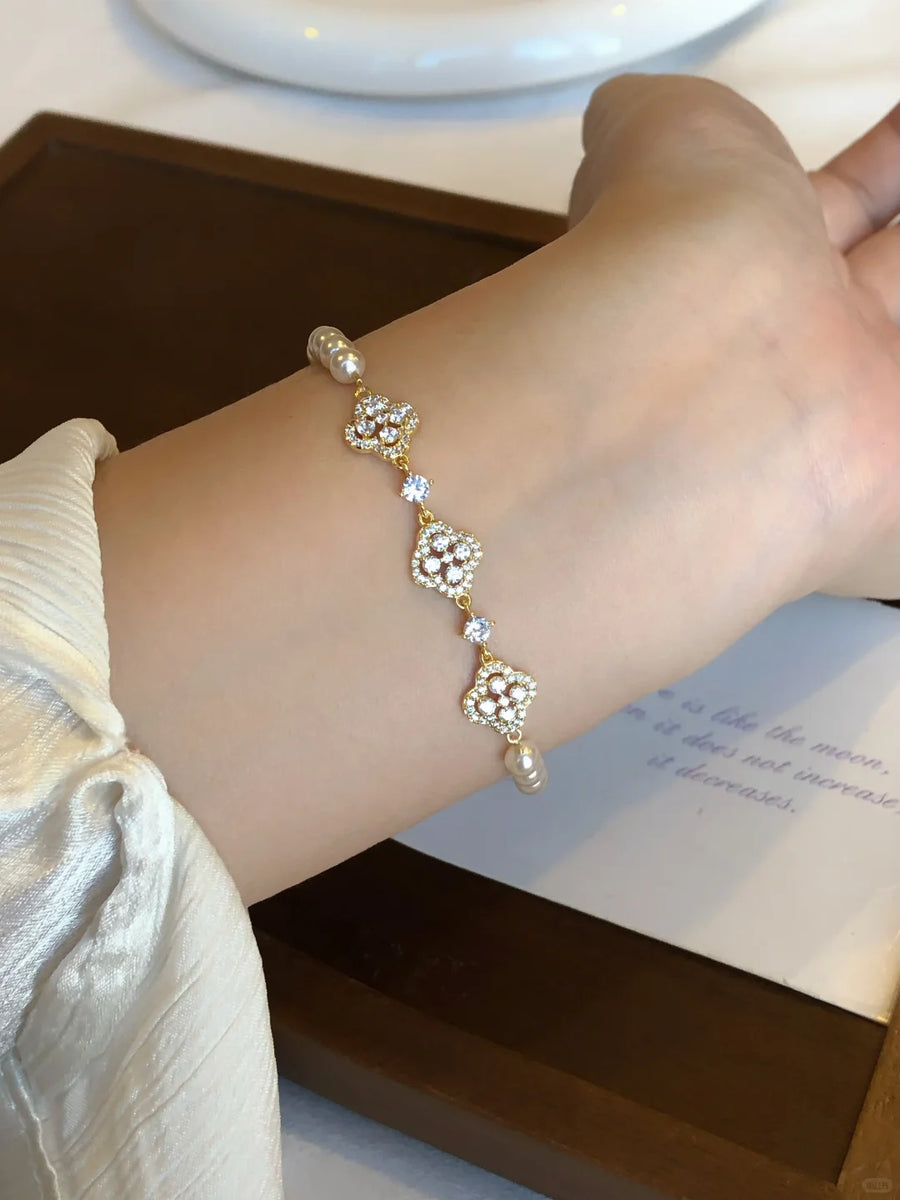 Front view of flower motif high-lustre freshwater pearl bracelet for bridal styling