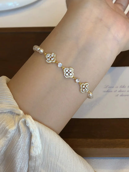 Close-up of flower motif high-lustre freshwater pearl bracelet for bridal styling