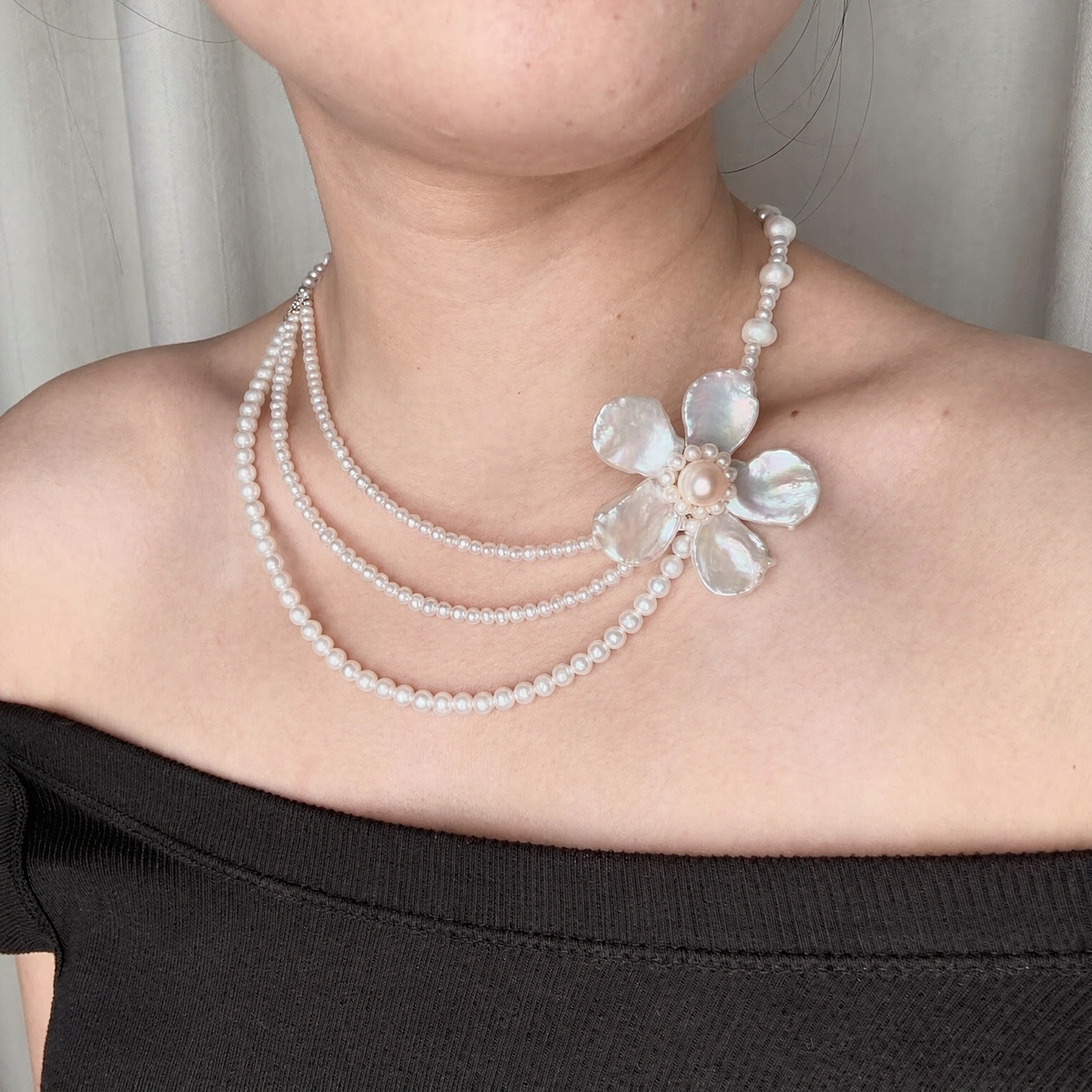 Close-up of Grand Fleur Multi-Strand Pearl Necklace showing natural freshwater baroque pearl details for editorial bridal looks