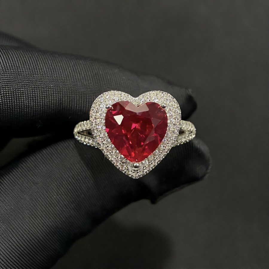 Front view of large oval lab-grown ruby halo statement ring for milestone anniversaries