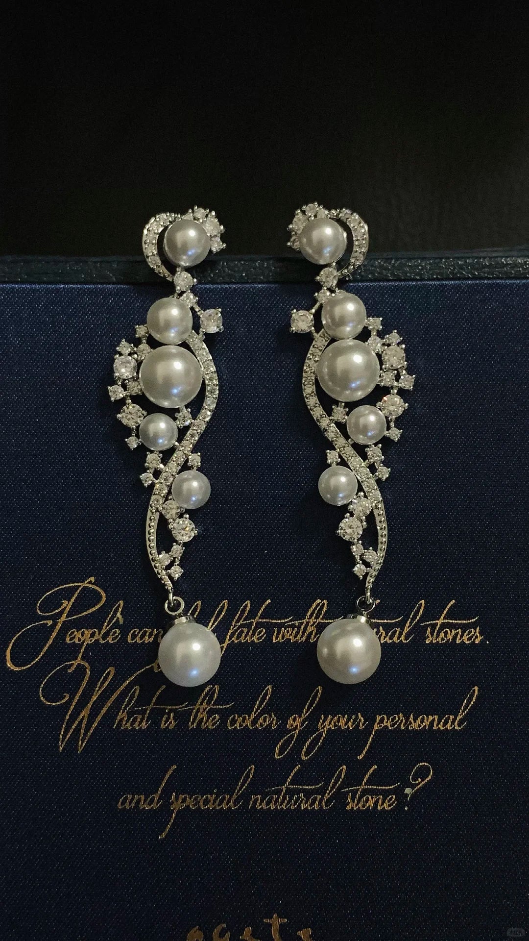 Front view of ornate grey drop high-lustre freshwater pearl earrings for wedding guest looks