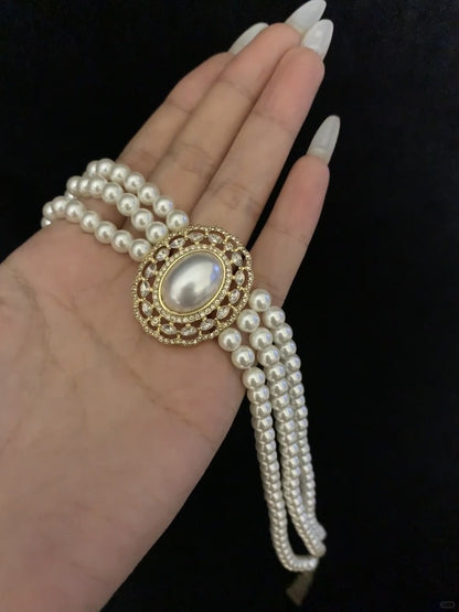 Styled view of multi-strand high-lustre freshwater pearl bracelet for bridal styling