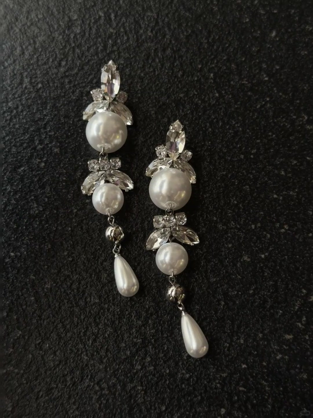 Front view of long drop high-lustre freshwater pearl earrings for wedding guest looks