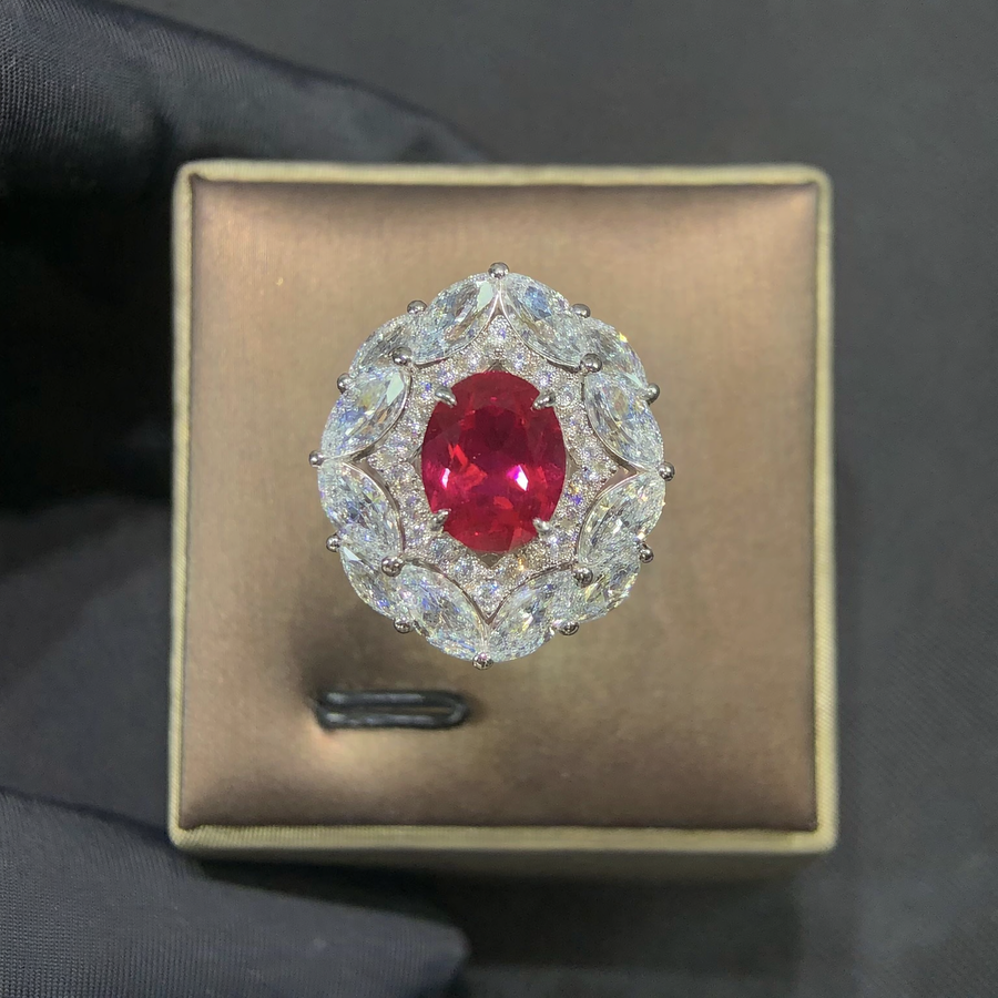 Front view of oval lab-grown ruby double halo statement ring for milestone anniversaries