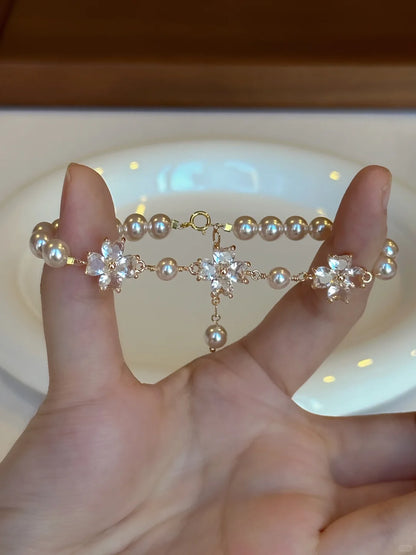 Close-up of floral motif high-lustre freshwater pearl bracelet for bridal styling