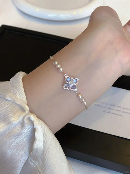 Detail view of floral motif high-lustre freshwater pearl bracelet for bridal styling