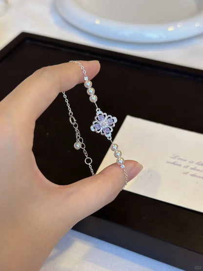 Side view of floral motif high-lustre freshwater pearl bracelet for bridal styling