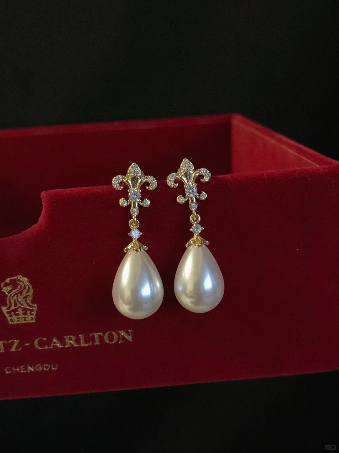 Front view of pearl flower drop high-lustre freshwater pearl earrings for wedding guest looks
