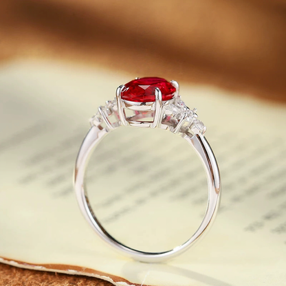 Side view of oval lab-grown ruby three-stone ring in 16K gold for engagement moments