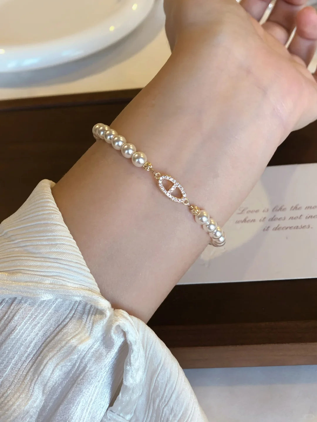 Close-up of half-chain high-lustre freshwater pearl bracelet for bridal styling