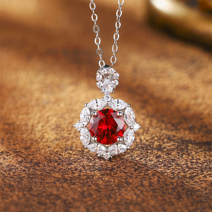 Front view of oval lab-grown ruby halo pendant necklace in 16K gold for romantic gifts