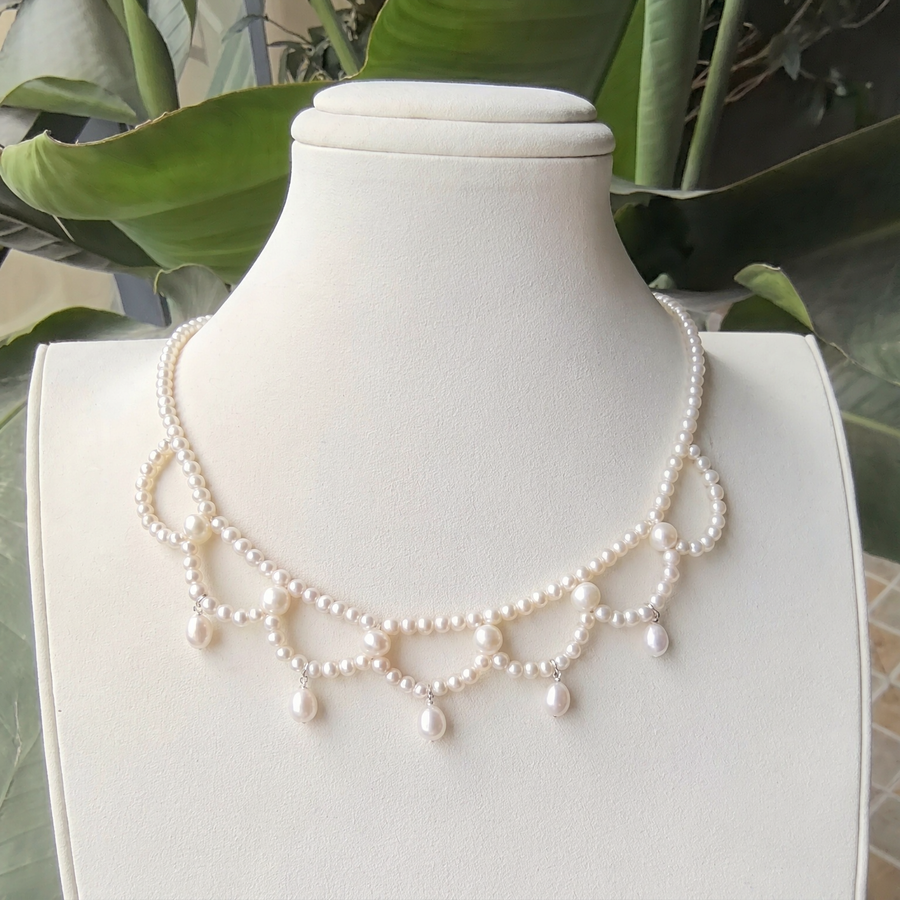 Front view of Lumière Draped Pearl Necklace, a natural freshwater pearl necklace for anniversary dinners