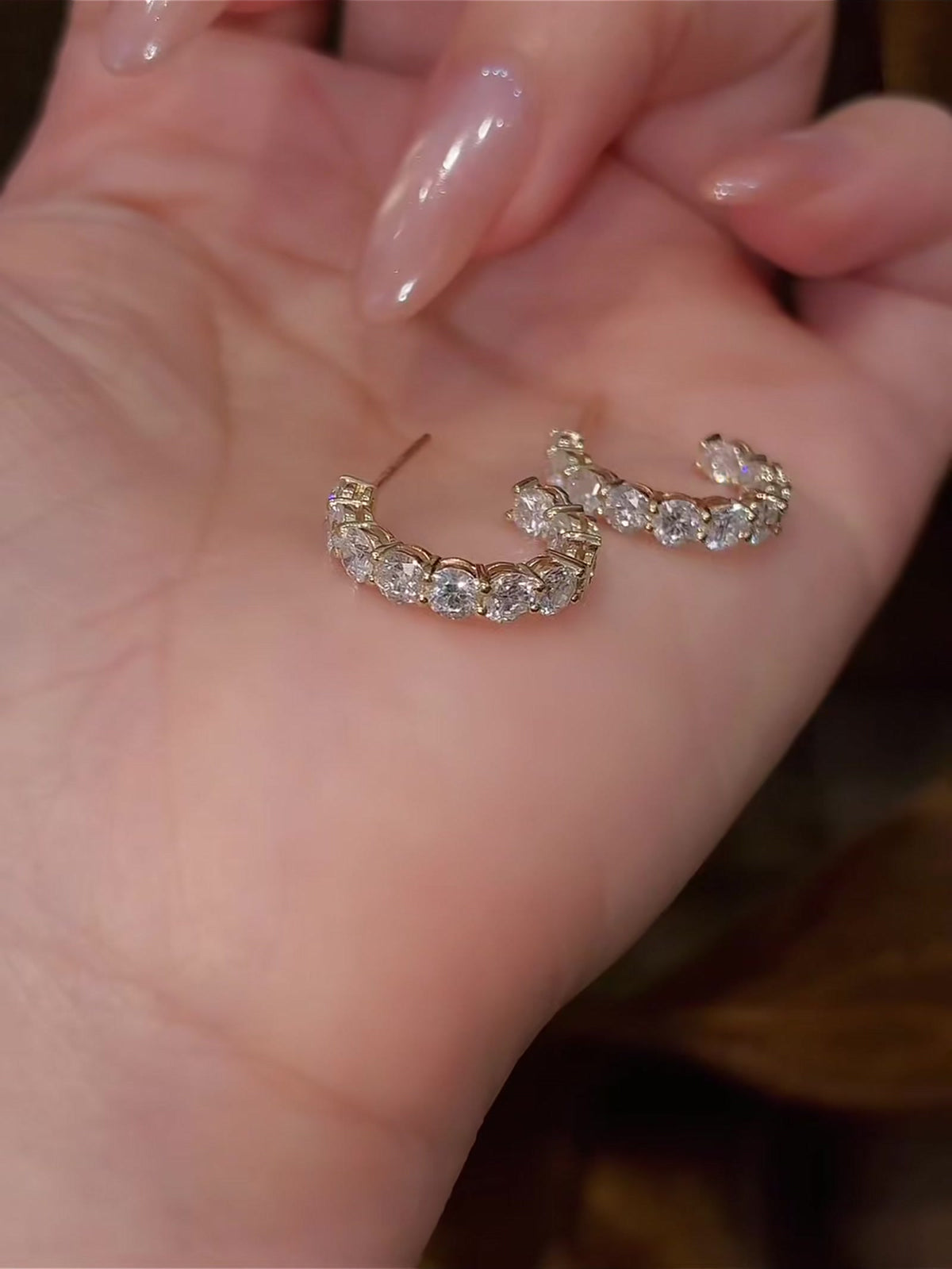 Luna lab-grown diamond crescent ring styled for an elegant evening