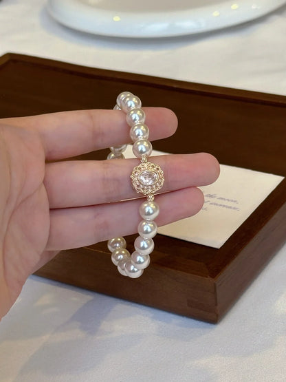 Front view of medallion high-lustre freshwater pearl bracelet for bridal styling