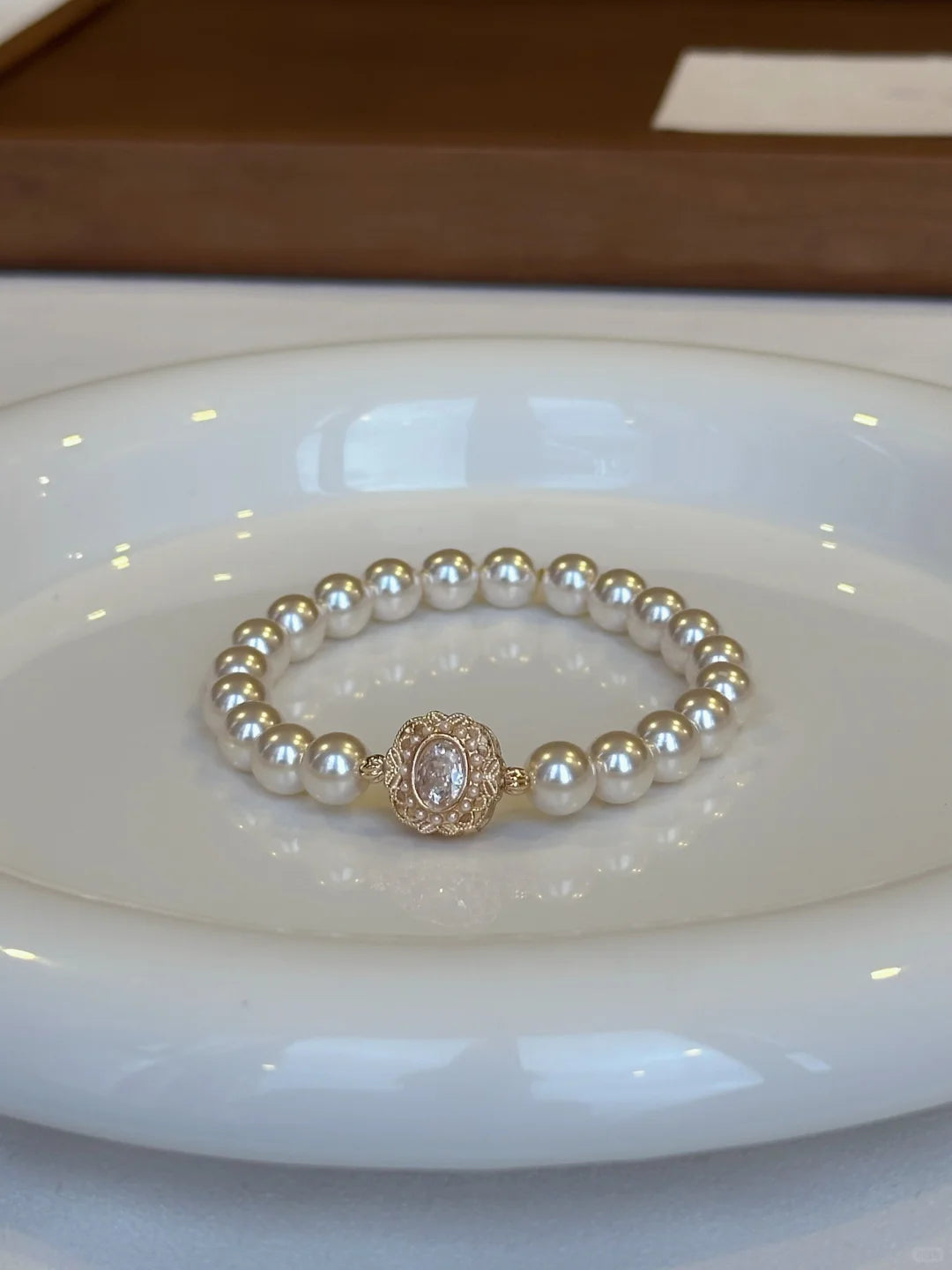 Close-up of medallion high-lustre freshwater pearl bracelet for bridal styling
