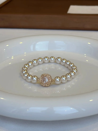 Close-up of medallion high-lustre freshwater pearl bracelet for bridal styling
