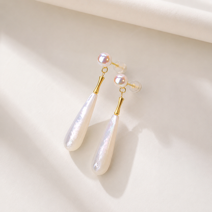 Detailed view of long baroque Akoya pearl drop earrings