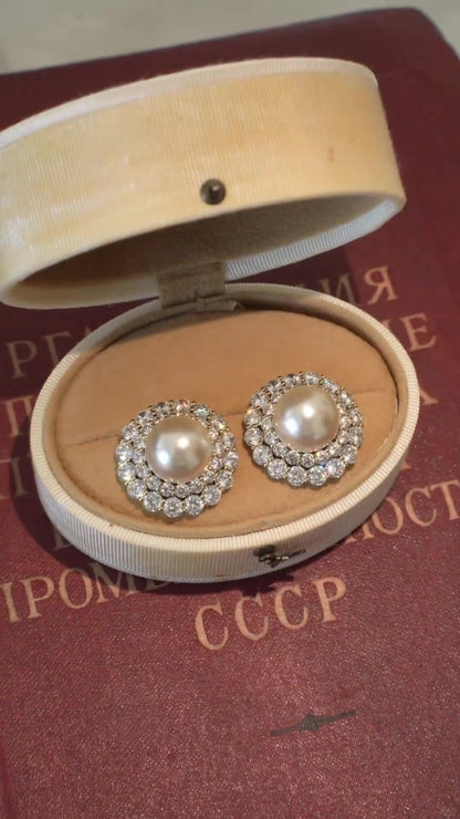 Front view of halo stud high-lustre freshwater pearl earrings for wedding guest looks