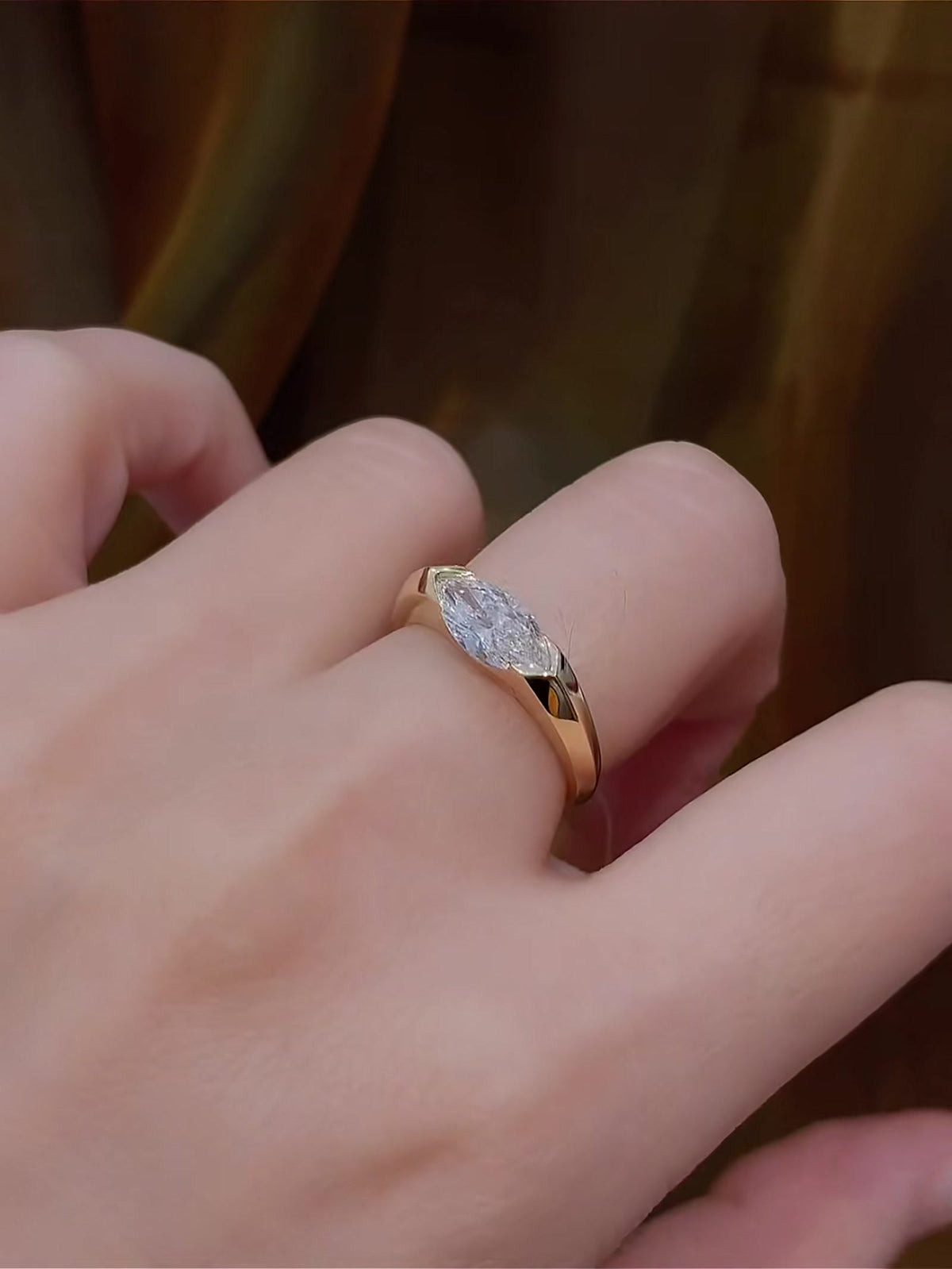 Close-up of lab-grown diamond east west marquise ring for minimal proposals