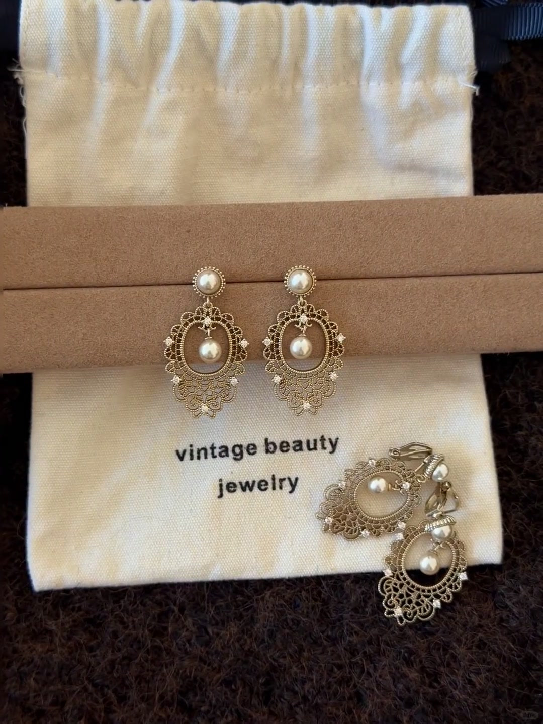 Styled view of lace drop high-lustre freshwater pearl earrings for wedding guest looks