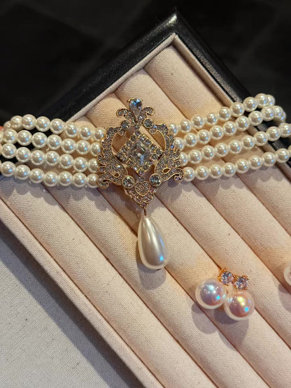Front view of baroque drop high-lustre freshwater pearl earrings for wedding guest looks