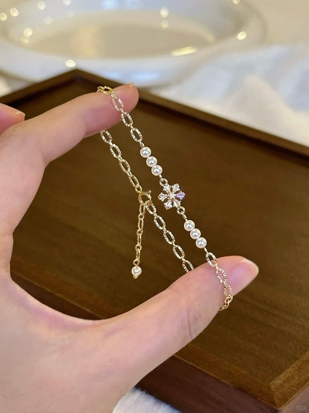 Styled view of pearl station high-lustre freshwater pearl bracelet for bridal styling