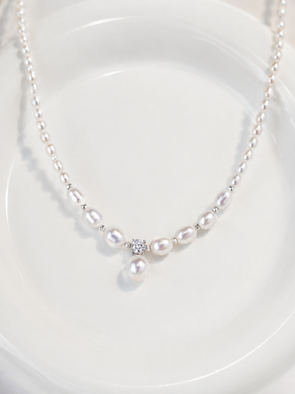 Mira freshwater pearl pendant necklace with silver spacers on a white background