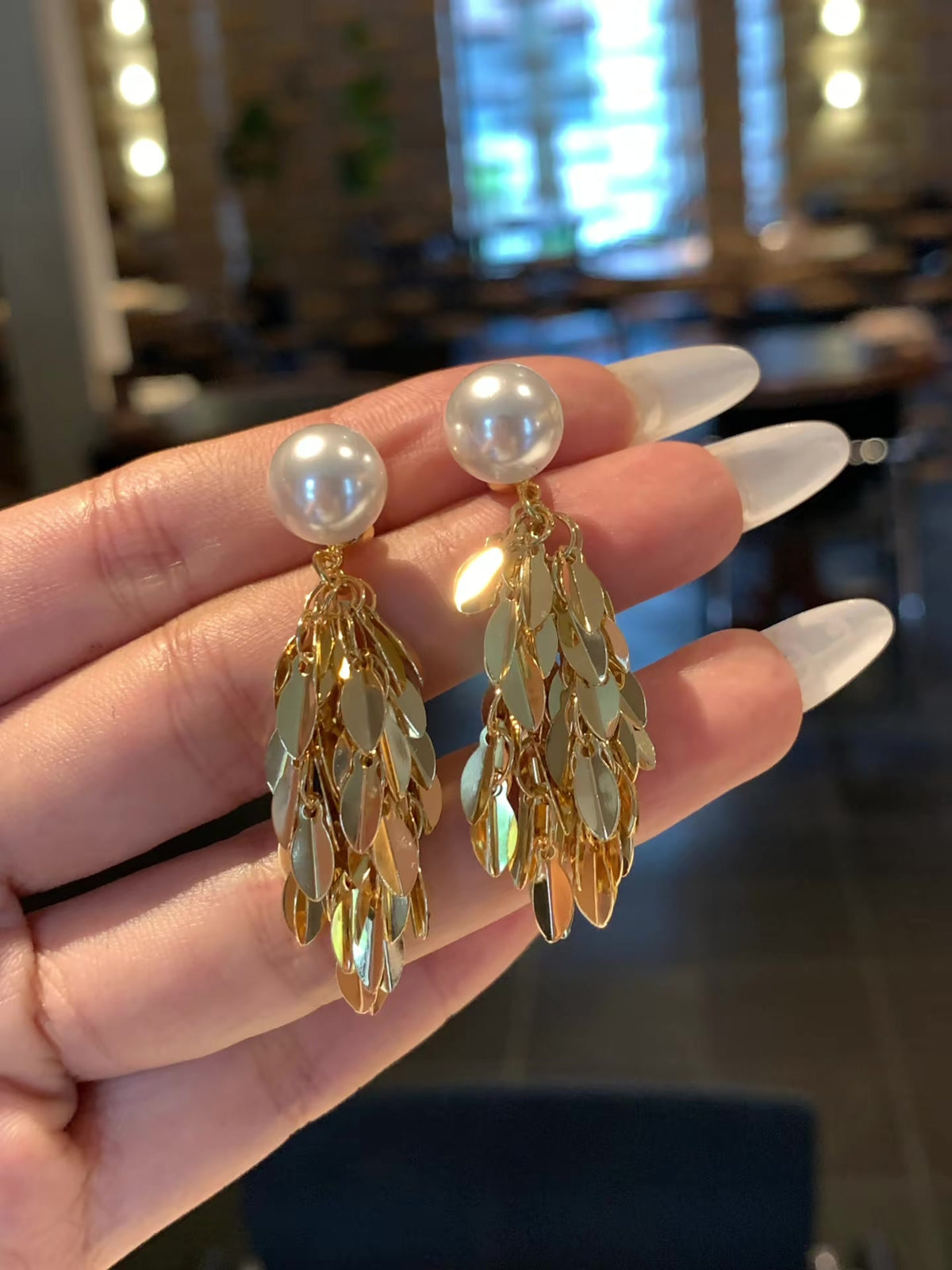 Front view of vintage statement high-lustre freshwater pearl earrings for wedding guest looks