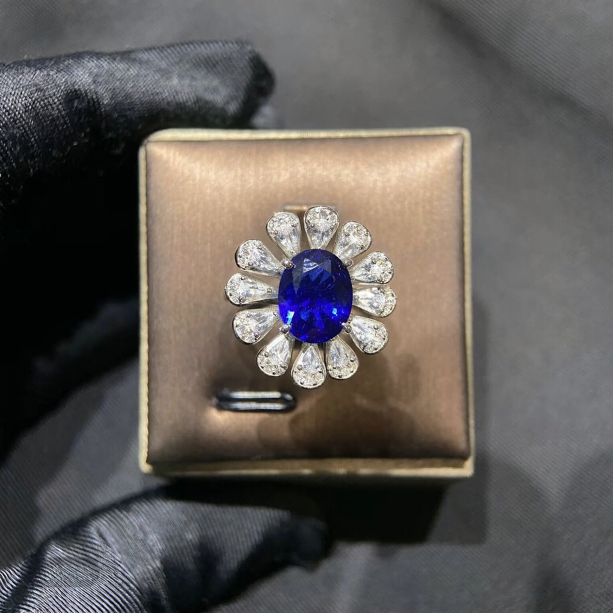 Front view of oval lab-grown blue sapphire floral ring for September birthdays