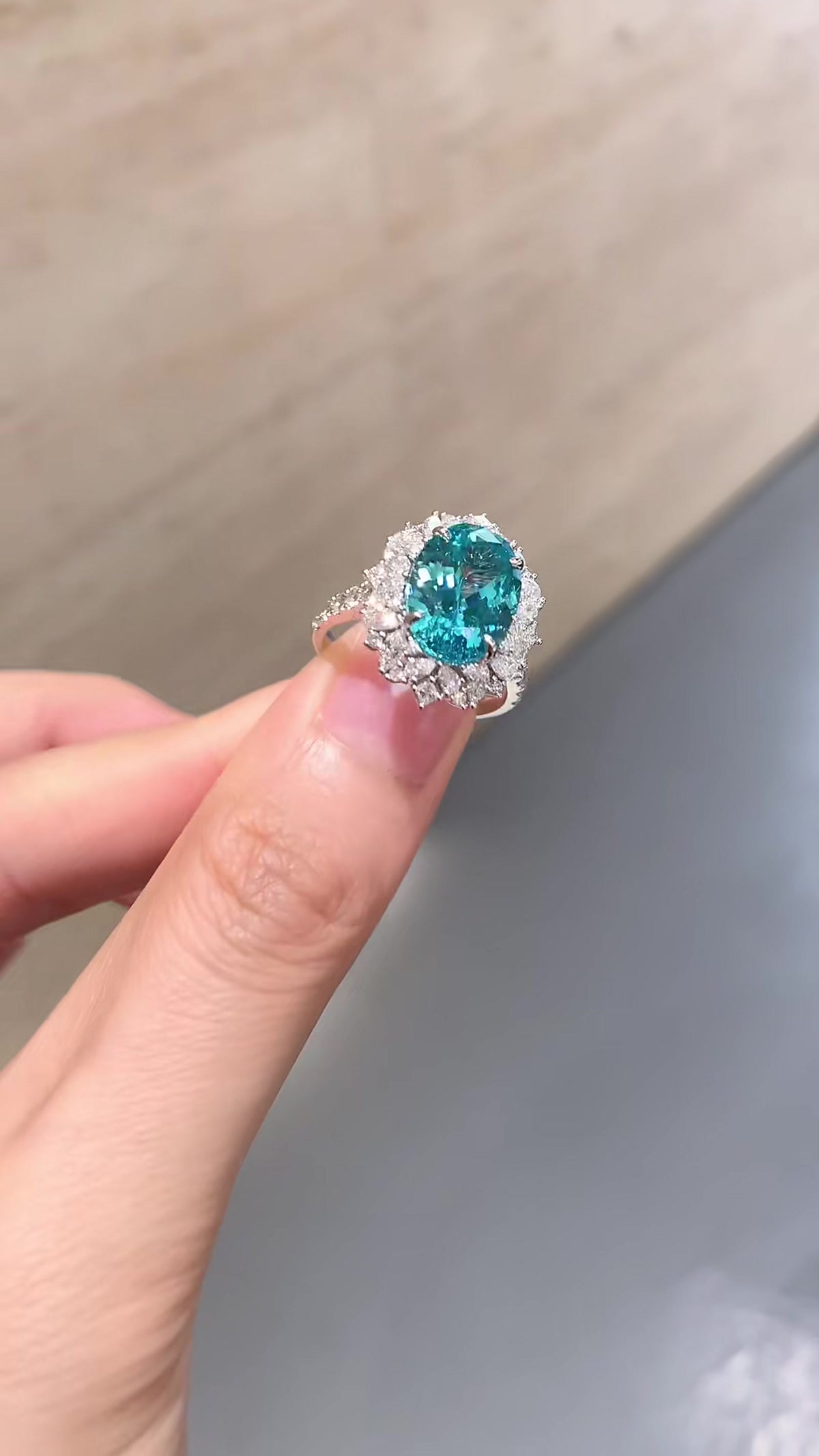 Front view of lab-grown Paraiba blue halo statement ring for cocktail parties