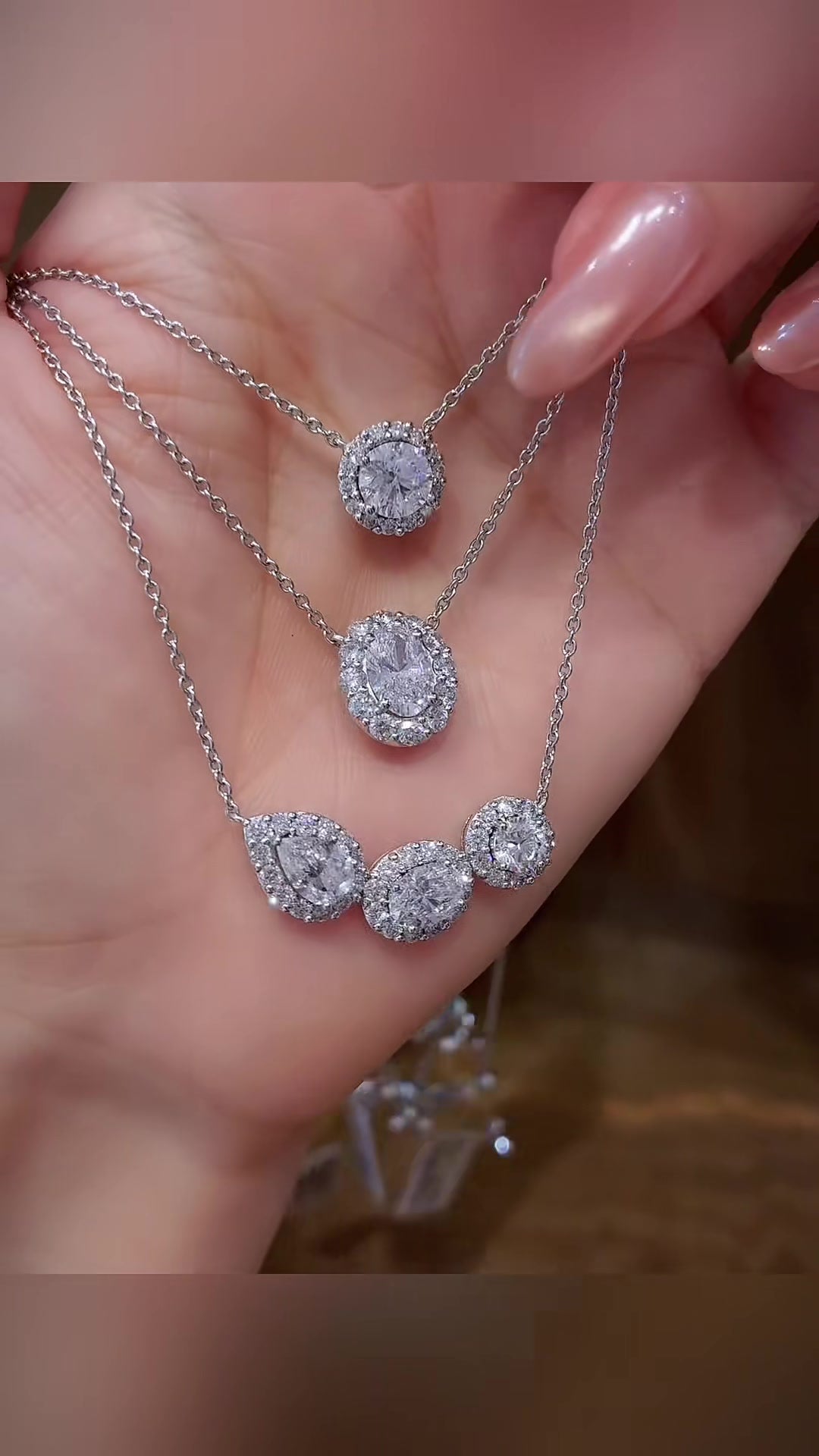 Front view of lab-grown diamond oval halo pendant necklace for wedding receptions