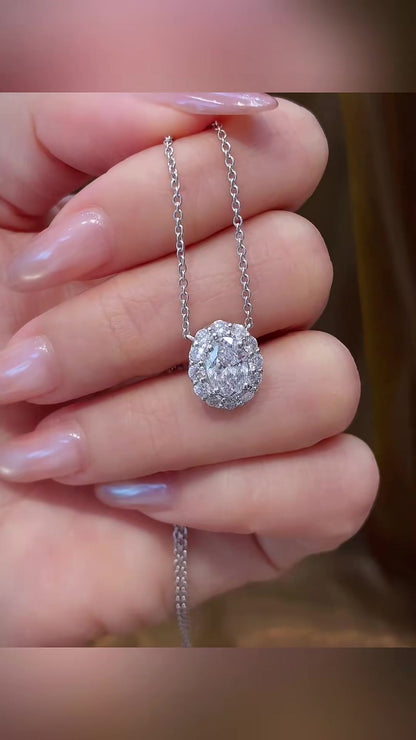 Styled view of lab-grown diamond oval halo pendant necklace for wedding receptions