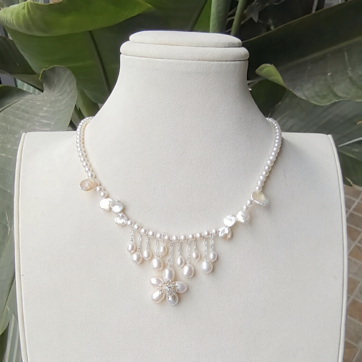 Front view of Petal Drop Pearl Necklace, a natural freshwater pearl necklace for wedding guest outfits