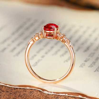 Close-up of delicate oval lab-grown ruby side-stone ring for everyday elegance