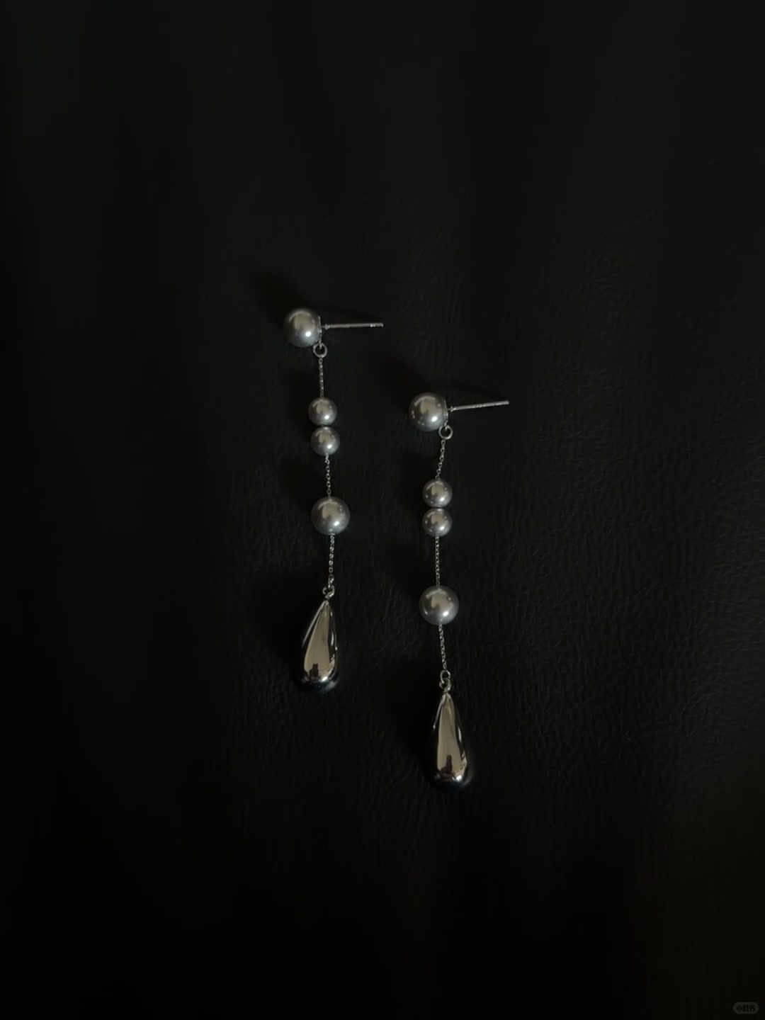 Front view of silver-tone drop high-lustre freshwater pearl earrings for wedding guest looks