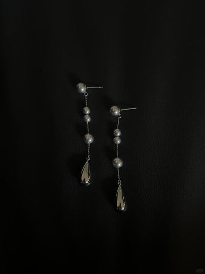 Front view of silver-tone drop high-lustre freshwater pearl earrings for wedding guest looks