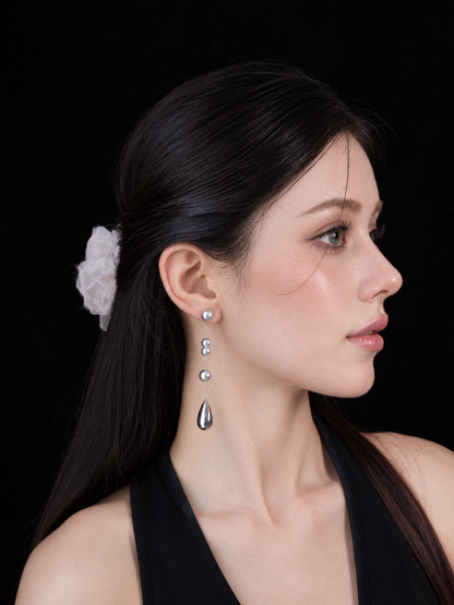 Front view of silver-tone drop high-lustre freshwater pearl earrings for wedding guest looks