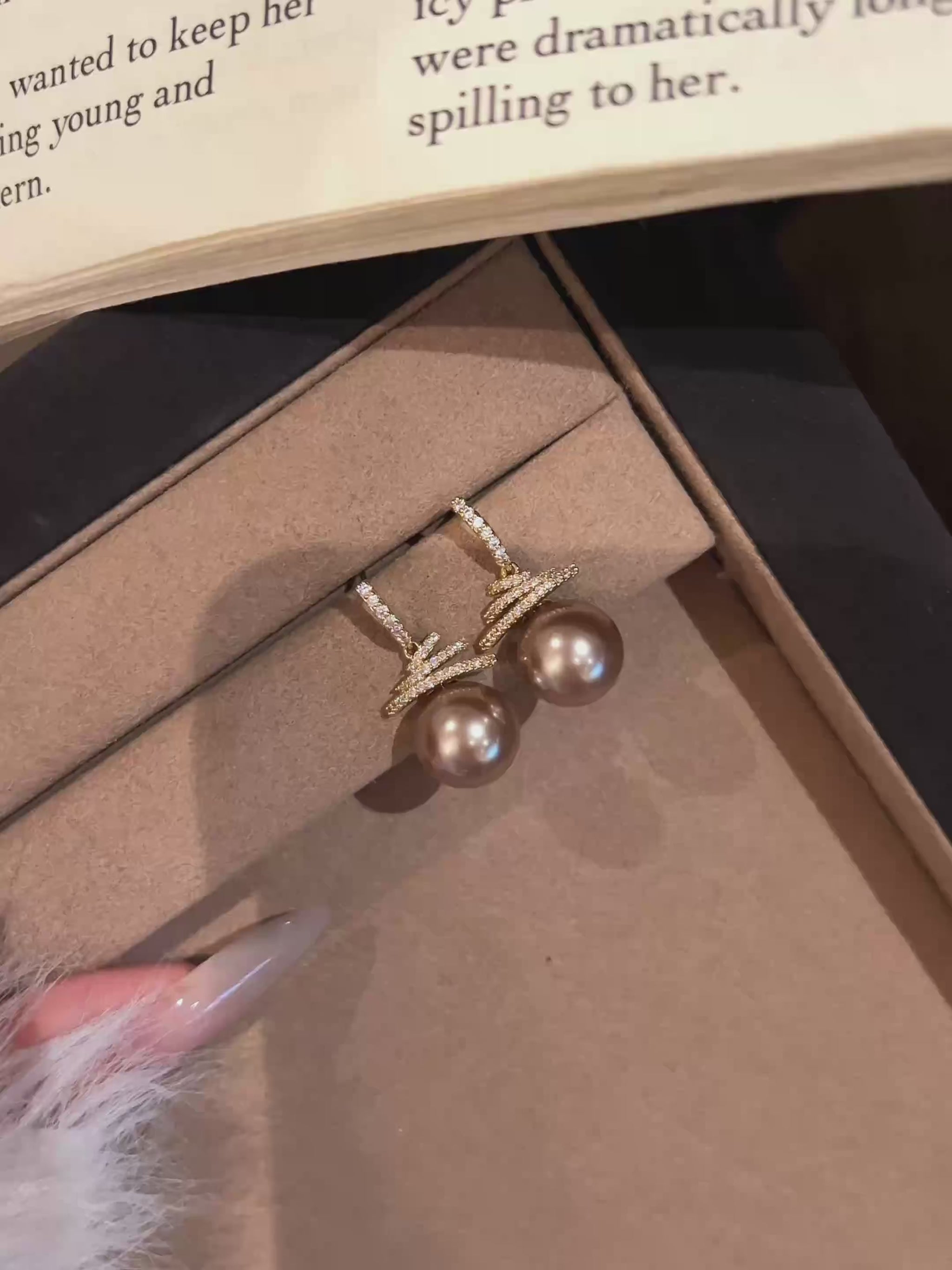 Video view of christmas tree high-lustre freshwater pearl earrings styled for wedding guest looks