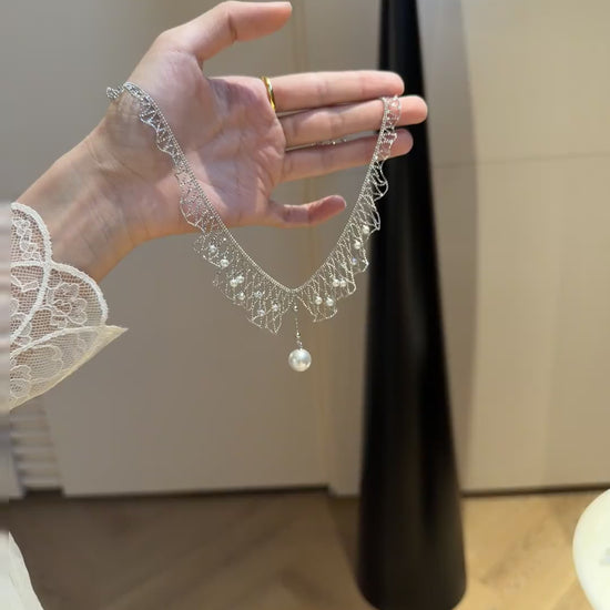 Video view of dreamcatcher high-lustre freshwater pearl necklace styled for weddings