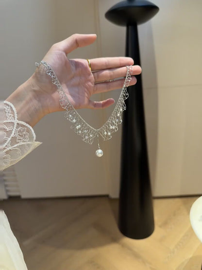 Video view of dreamcatcher high-lustre freshwater pearl necklace styled for weddings